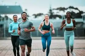 image of man and 3 women doing cardio exercise Woodley  to help tone and remove fat from the body.