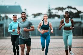 Sculpting Sleek Arms: The Essential Role of Cardio in Toning Without Bulking Up 3 image of people running to incorporate cardio Woodley exercise into their life to help tone arms and body.