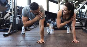 Sculpting Sleek Arms: The Essential Role of Cardio in Toning Without Bulking Up 1 Image of man and woman doing Cardio Woodley to tone their arms.